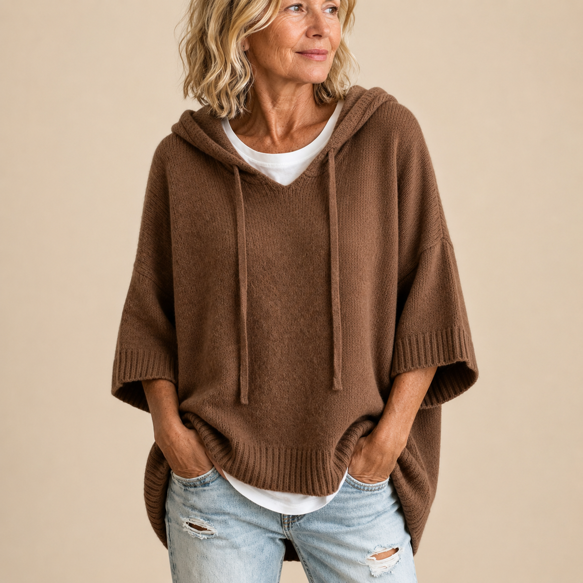 Oriana | Poncho in maglia con cappuccio e manica a tre quarti